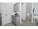 Charming kitchen with gray cabinets, granite countertops and a coffee bar near staircase at 2409 Seabreeze Pl., Myrtle Beach, SC 29577
