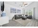 Bright living room featuring vaulted ceiling, modern decor, and a comfortable gray sectional sofa at 2409 Seabreeze Pl., Myrtle Beach, SC 29577