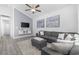 Bright living room featuring vaulted ceiling, modern decor, and a comfortable gray sectional sofa at 2409 Seabreeze Pl., Myrtle Beach, SC 29577