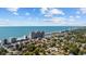 An aerial view shows a home, beach, and cityscape near the coast at 2602 Holly Dr., North Myrtle Beach, SC 29582