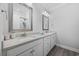 Bright bathroom features a double vanity with modern fixtures and a glass-enclosed shower with stylish accents at 2602 Holly Dr., North Myrtle Beach, SC 29582