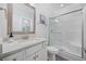 Bright bathroom features a vanity with modern fixtures and a glass-enclosed shower with stylish accents at 2602 Holly Dr., North Myrtle Beach, SC 29582