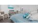 Comfortable bedroom with a brass bed frame, coastal decor, and a wall-mounted TV for relaxing at 2602 Holly Dr., North Myrtle Beach, SC 29582