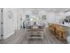 Open concept dining area with table set for six and breakfast bar seating at 2602 Holly Dr., North Myrtle Beach, SC 29582