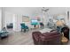 An open-concept living room with hardwood floors, stylish furniture, and abundant natural light at 2602 Holly Dr., North Myrtle Beach, SC 29582