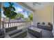 Inviting covered porch with comfortable seating, a ceiling fan, and a view of the surrounding neighborhood at 2602 Holly Dr., North Myrtle Beach, SC 29582