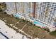 Aerial view of the complex's pool area, landscaping, and proximity to the beach, perfect for seaside enjoyment at 2801 South Ocean Blvd. # 335, North Myrtle Beach, SC 29582