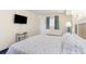 Bedroom showcases a queen-sized bed, wall-mounted TV, and calming decor at 2801 South Ocean Blvd. # 335, North Myrtle Beach, SC 29582