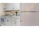 Clean kitchen features white appliances, cabinets, and granite countertops at 2801 South Ocean Blvd. # 335, North Myrtle Beach, SC 29582