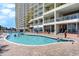 Outdoor pool with brick paver decking offers a refreshing experience near the building's beach access at 2801 South Ocean Blvd. # 335, North Myrtle Beach, SC 29582