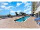 Relaxing outdoor pool area with ample lounge chairs, ideal for sunbathing and enjoying the waterfront views at 2801 South Ocean Blvd. # 335, North Myrtle Beach, SC 29582