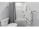 Full bathroom showing the tub-shower combo with white shower curtain and a toilet at 295 Brackish Dr. # 673, Myrtle Beach, SC 29588