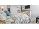 Comfortable bedroom with a bed, dresser, and walk-in closet; TV on the wall at 295 Brackish Dr. # 673, Myrtle Beach, SC 29588