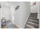 Hallway with a carpeted staircase, an exterior door and lovely decor at 295 Brackish Dr. # 673, Myrtle Beach, SC 29588