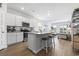 Open concept kitchen with stainless steel appliances and eat-in island at 295 Brackish Dr. # 673, Myrtle Beach, SC 29588