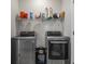 Bright laundry room features modern LG washer and dryer with storage shelf above at 295 Brackish Dr. # 673, Myrtle Beach, SC 29588