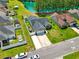 Aerial shot showcases a home's large yard and proximity to a tranquil pond at 305 Blue Rock Dr., Longs, SC 29568