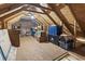 View of attic storage space, with exposed wooden rafters and ample room for organization, and a overhead light at 305 Blue Rock Dr., Longs, SC 29568