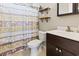 This bathroom features a stylish vanity, toilet, and decorative shower curtain for a modern and functional space at 305 Blue Rock Dr., Longs, SC 29568