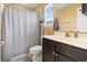 This bathroom offers a dark vanity with storage, a toilet, and a shower/bath combo providing functionality and style at 305 Blue Rock Dr., Longs, SC 29568