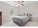 Relaxing bedroom with a neutral color palette, soft carpet, natural light from a window, and a comfortable queen-sized bed at 305 Blue Rock Dr., Longs, SC 29568