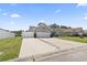 Expansive driveway leading to a well-maintained home with a neatly landscaped front yard at 305 Blue Rock Dr., Longs, SC 29568