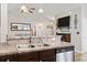Open-concept kitchen offers bar seating and connects seamlessly to the living area at 305 Blue Rock Dr., Longs, SC 29568