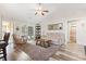 The living room boasts a vaulted ceiling and sliding glass door to the back yard at 305 Blue Rock Dr., Longs, SC 29568