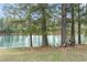 This captivating pond view is complemented by mature trees and natural landscaping, offering tranquility and scenic beauty at 305 Blue Rock Dr., Longs, SC 29568