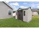 View of the outdoor storage shed in the backyard, offering a solution for storing gardening tools and equipment at 305 Blue Rock Dr., Longs, SC 29568