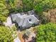 Aerial view of the home nestled among lush, mature trees in a private setting at 321 Heather Ct., Sunset Beach, NC 28468