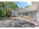 Spacious backyard featuring a patio area and mature trees at 321 Heather Ct., Sunset Beach, NC 28468