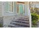 Inviting front entrance with brick steps, decorative door, and a well-maintained exterior at 321 Heather Ct., Sunset Beach, NC 28468