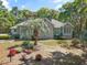 Charming single-story home featuring a brick facade, manicured landscaping, and mature trees at 321 Heather Ct., Sunset Beach, NC 28468