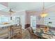 Cozy kitchen dining area with patterned flooring, an open layout, and views into the kitchen and laundry room at 321 Heather Ct., Sunset Beach, NC 28468