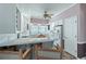 Bright kitchen featuring white cabinets, tiled countertops, and an open breakfast bar area at 321 Heather Ct., Sunset Beach, NC 28468
