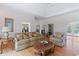 Spacious living room featuring hardwood floors, arched doorways, and elegant furnishings at 321 Heather Ct., Sunset Beach, NC 28468