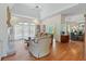 Open living area with hardwood floors, ample natural light, and views into dining space at 321 Heather Ct., Sunset Beach, NC 28468