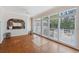 Bright sunroom with hardwood floors, large windows, and views to the backyard at 321 Heather Ct., Sunset Beach, NC 28468