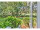 Lush backyard featuring mature trees, manicured landscaping, and a tranquil setting at 356 Chapman Loop, Pawleys Island, SC 29585