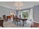 Elegant dining room with chandelier and large windows at 356 Chapman Loop, Pawleys Island, SC 29585