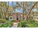 Brick home featuring a grand entrance with columns and well-maintained landscaping and walkway at 356 Chapman Loop, Pawleys Island, SC 29585