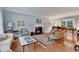 Inviting living room with hardwood floors, fireplace, and large windows creating a cozy atmosphere at 356 Chapman Loop, Pawleys Island, SC 29585
