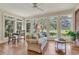 Bright sun room with large windows and hardwood floors at 356 Chapman Loop, Pawleys Island, SC 29585