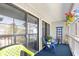 Cozy balcony with blue carpeting, plants, and comfortable seating at 3700 Golf Colony Lane # 18-G, Little River, SC 29566