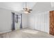 Bedroom featuring luxury vinyl flooring, ceiling fan, natural light, and a closet at 3700 Golf Colony Lane # 18-G, Little River, SC 29566