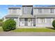 Charming condo featuring inviting entrance, well-kept landscaping, and traditional architectural details at 3700 Golf Colony Lane # 18-G, Little River, SC 29566