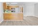 Kitchen and living area with stainless appliances, breakfast bar, and neutral paint colors at 3700 Golf Colony Lane # 18-G, Little River, SC 29566