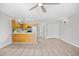 Modern kitchen featuring stainless appliances, open-concept layout, and wood flooring at 3700 Golf Colony Lane # 18-G, Little River, SC 29566