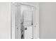 Laundry area with stacked washer and dryer and bi-fold doors at 3700 Golf Colony Lane # 18-G, Little River, SC 29566